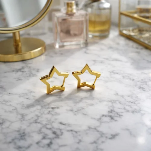 Žvaigždės formos auskarai aukso spalvos